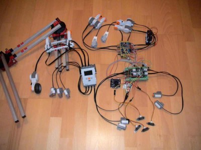 Arduino Due as a multi-I/O muxer to a Lego Mindstorms NXT<br />local on the NXT: 3 encoder motors plus 3 US sensors<br />remote on the Arduino Due muxer: 4 analog Lego sensors, <br />4 analog Sharp IR sensors, <br />6 encoder motors (Mega: 8), <br />a PixyCam, <br />plus (unfortunately not shown): additionally 16 touch sensors <br />plus optionally 1 PC keyboard attached to the Arduino board